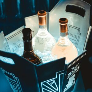 a couple of bottles of alcohol sitting inside of a box
